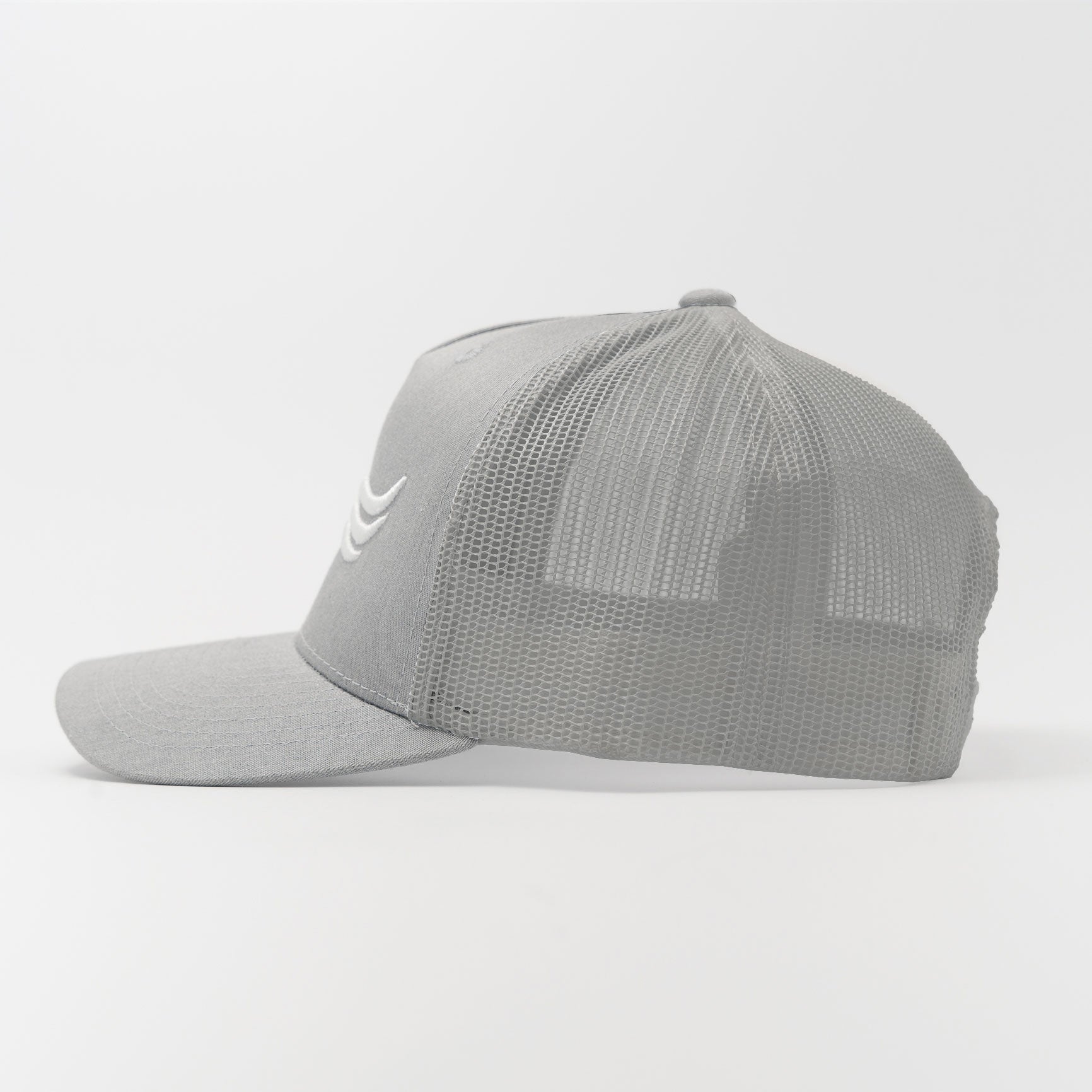 Trucker Hat – Graphite Flow | Side profile with ventilated mesh and grey tone