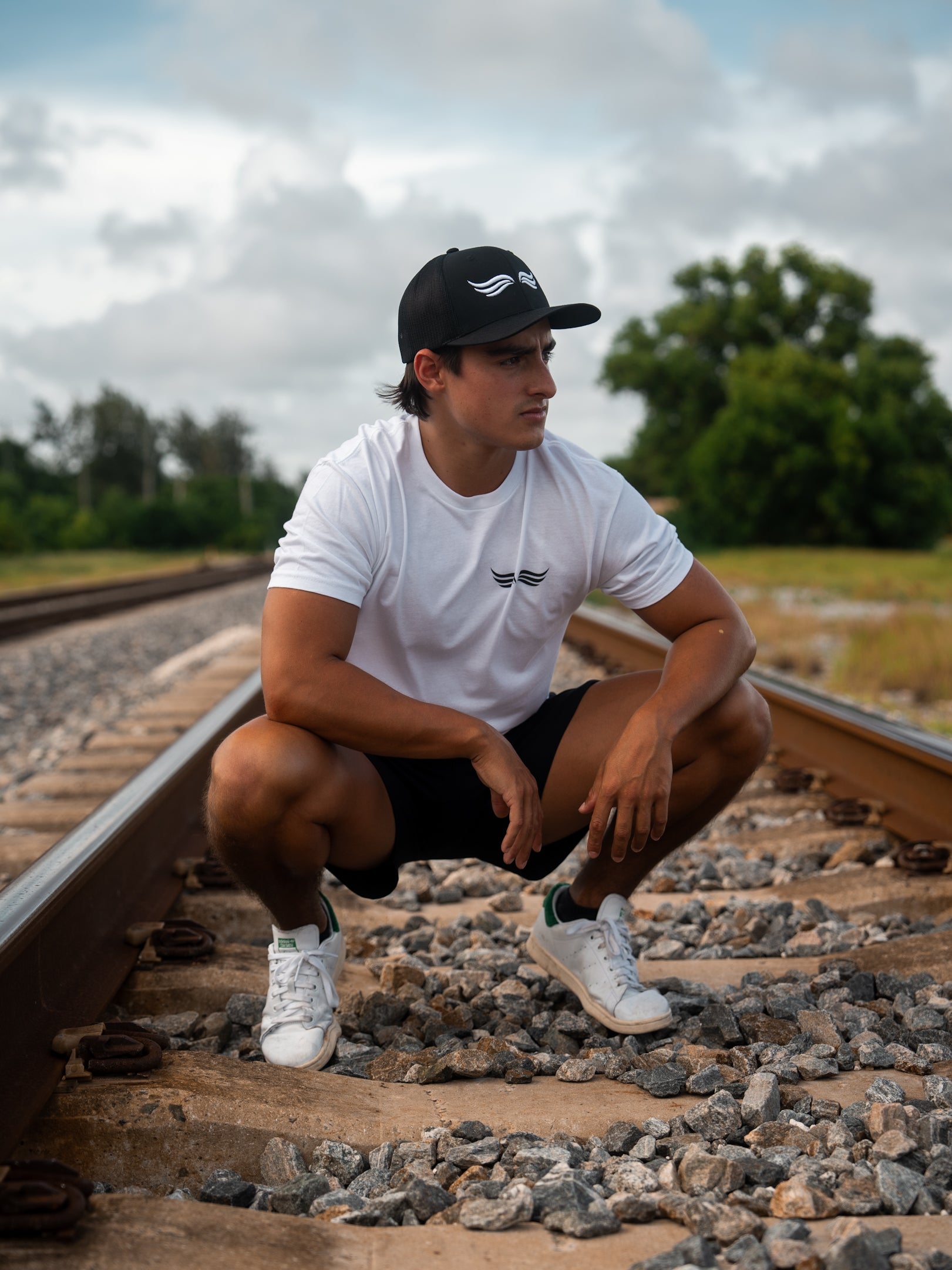 Trucker Hat – Core Black | Detail of cotton front panel and curved visor
